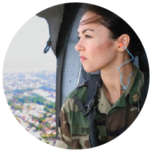 Public Health Service officer rides in a helicopter.